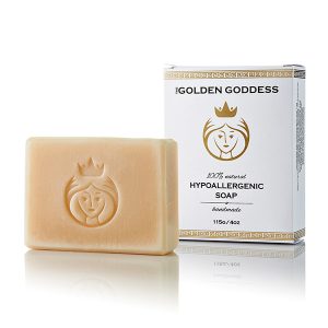 the golden goddess soap bar in peach color and white packaging