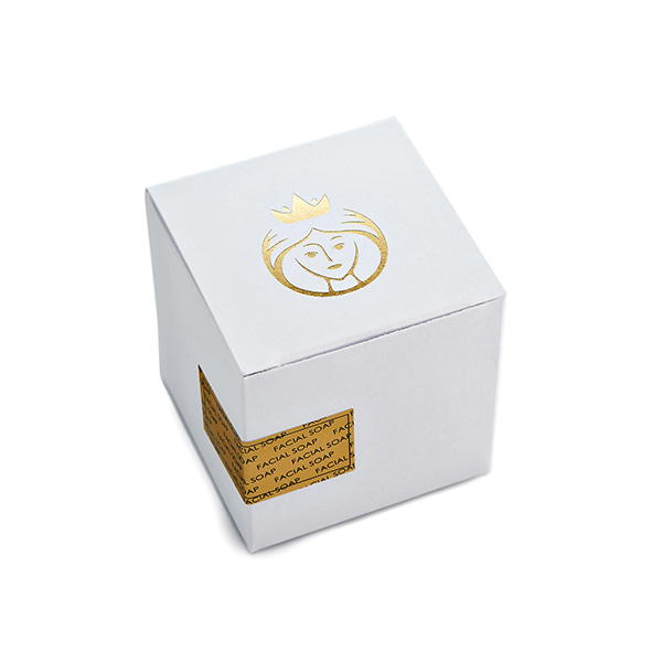 small white box with gold logo for facial soap