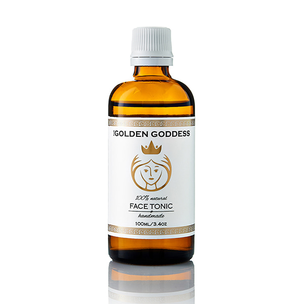 small bottle with the golden goddess face tonic label on it